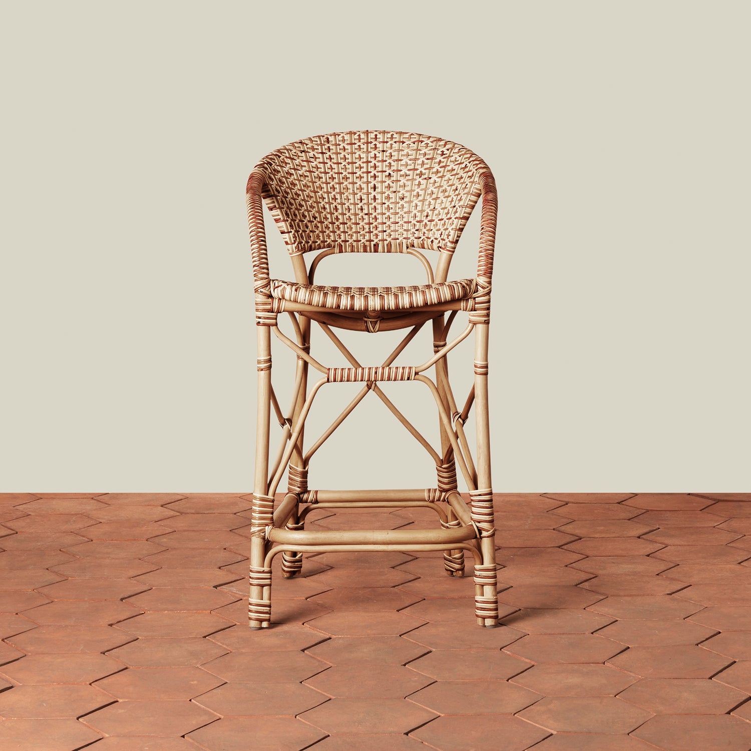 beige woven counter stool on tile floor with neutral background- Number 3