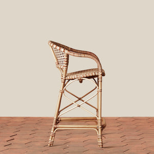 side of beige woven counter stool on tile floor with neutral background - Number 3