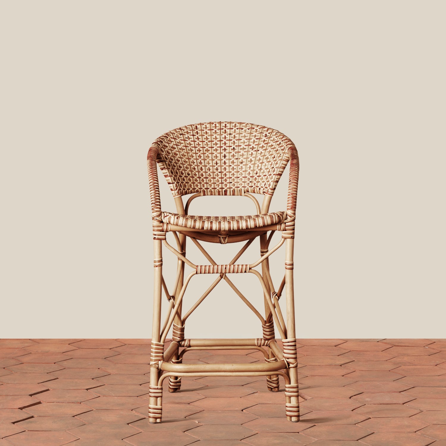 beige woven counter stool on tile floor with neutral background- Number 2