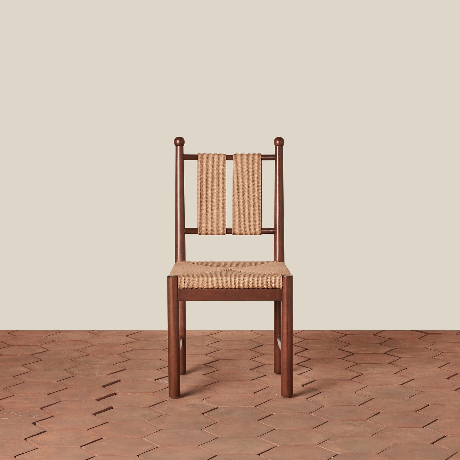 Wooden chair with woven backrest on a wooden floor and beige wall background- Number 5