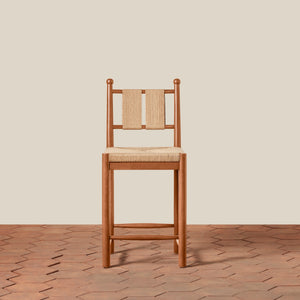 Wooden chair with woven backrest on a wooden floor and beige wall - Number 9