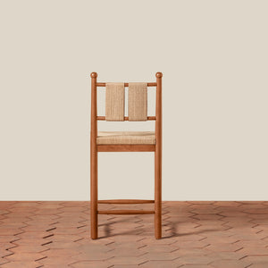 Wooden chair with woven backrest on a wooden floor and beige wall - Number 10