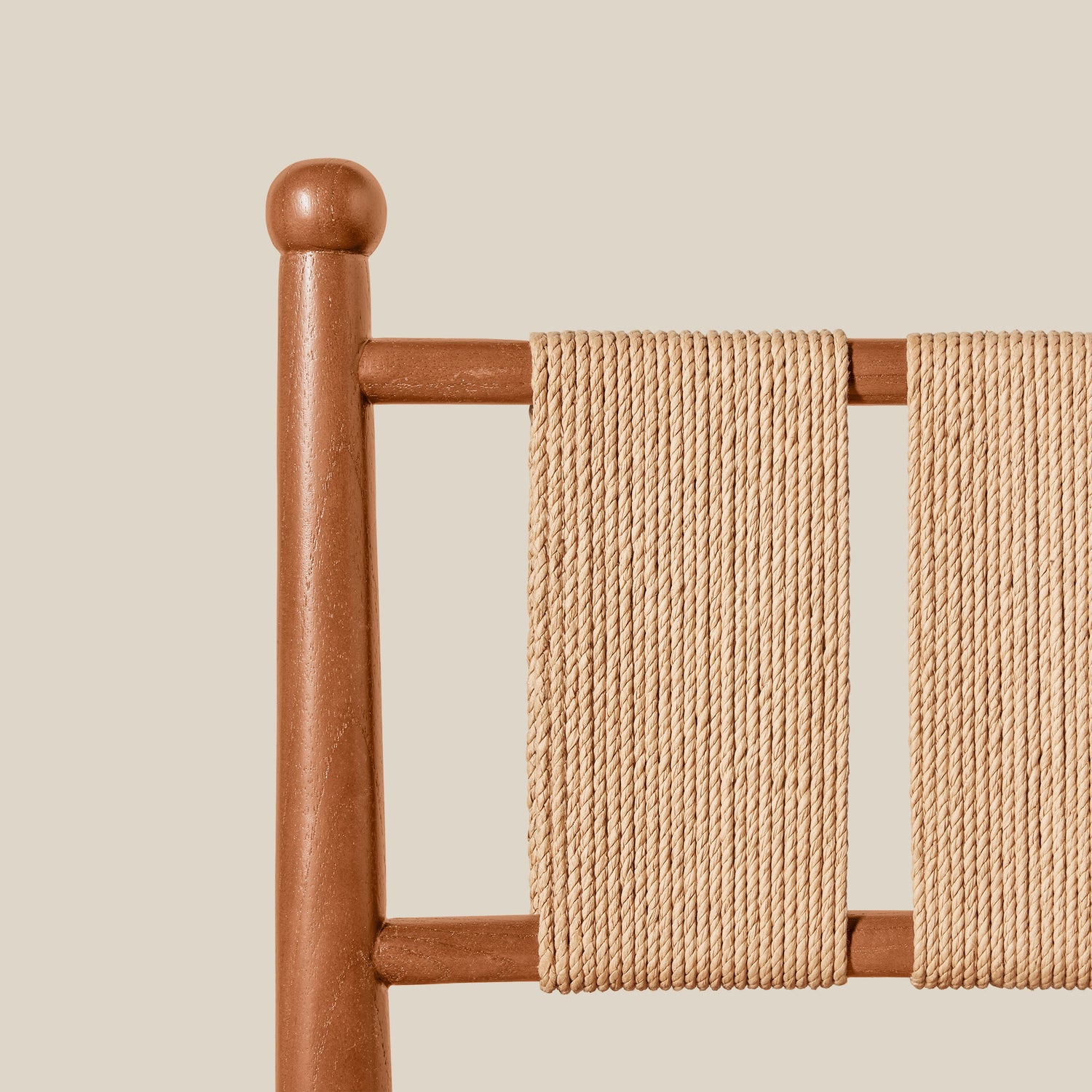 Wooden chair with a beige woven backrest against a beige background- Number 11