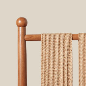 Wooden detail of chair back on a beige background - Number 13