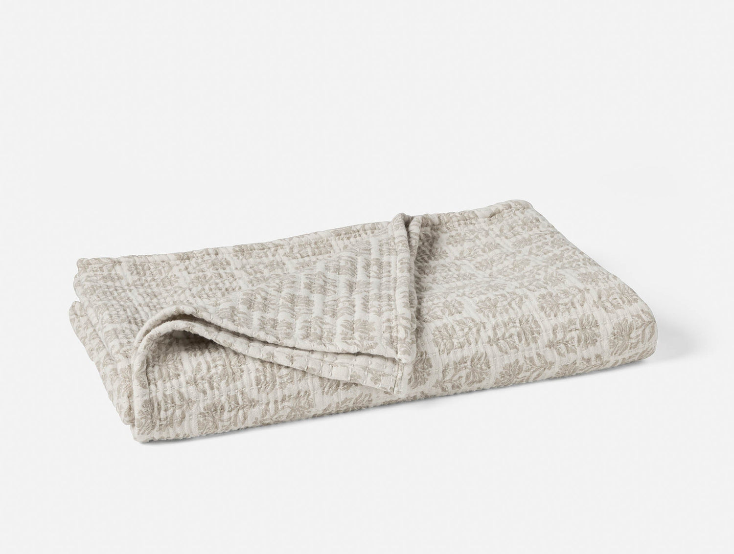 Folded textured blanket on a white background- Number 1