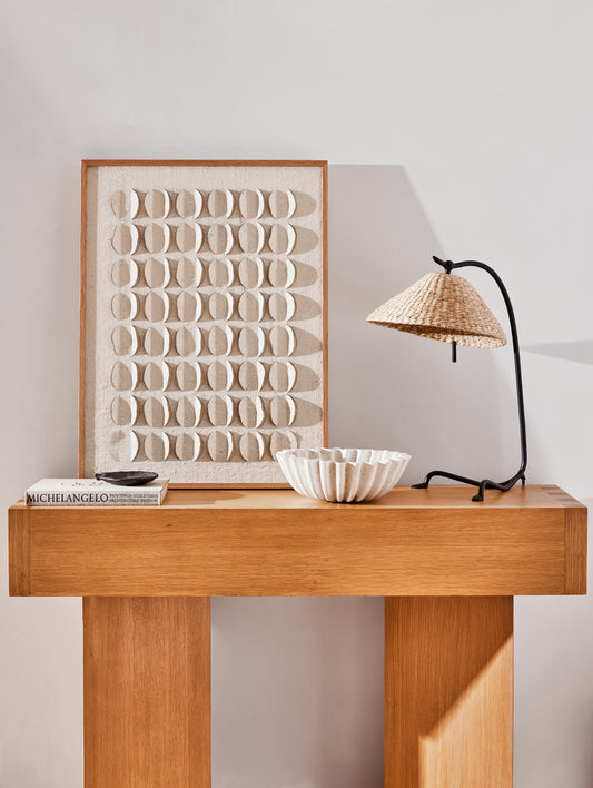 Wooden console table with decorative items against a light wall - Image 2