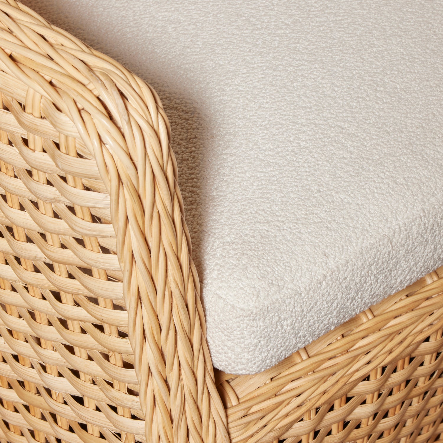 Close-up of a wicker basket with a white cushion inside- Number 6