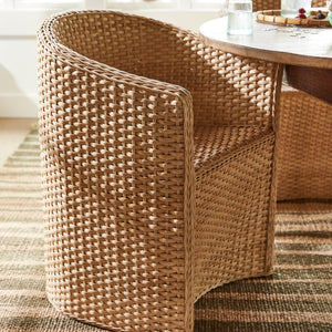 large chair with round background next to rounded table and striped carpet - Number 3
