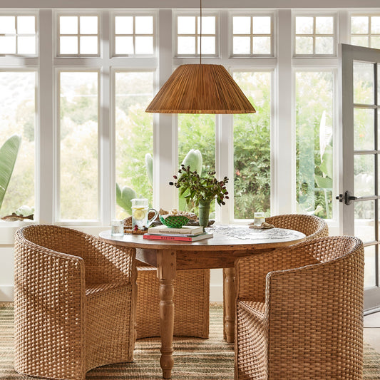 three large chairs around circular table with rattan pendant light above - Image 2