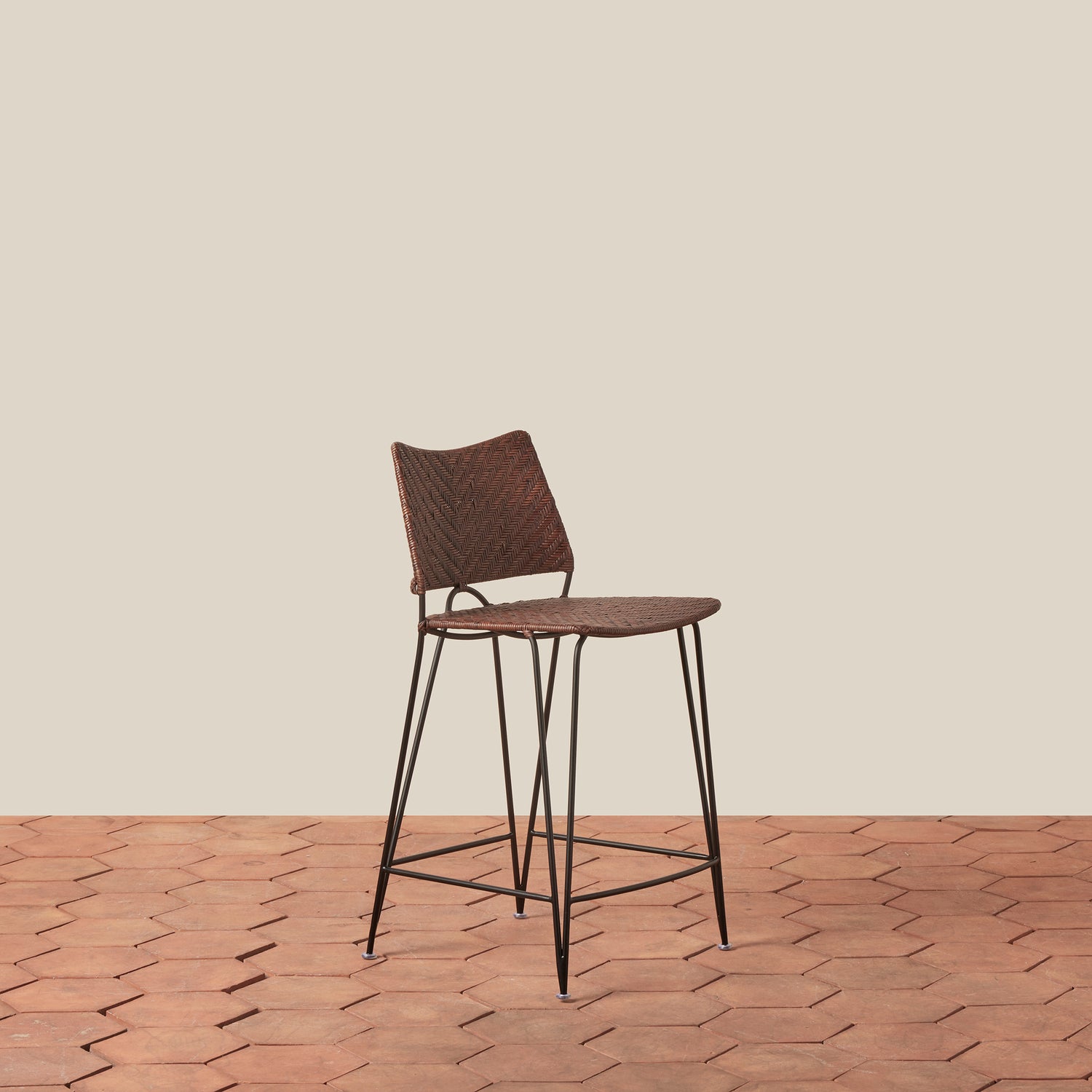 Brown bar stool with metal legs on a wooden floor and beige wall background- Number 7