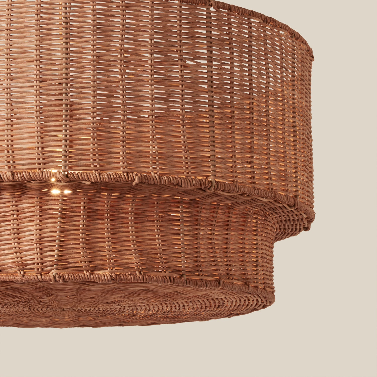 detail of woven brown chandelier against neutral background- Number 6