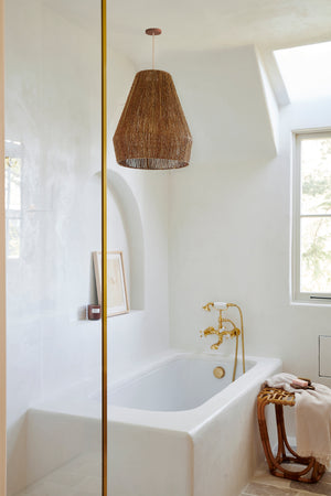 brown pendant light hanging in bathroom with white tub - Number 3