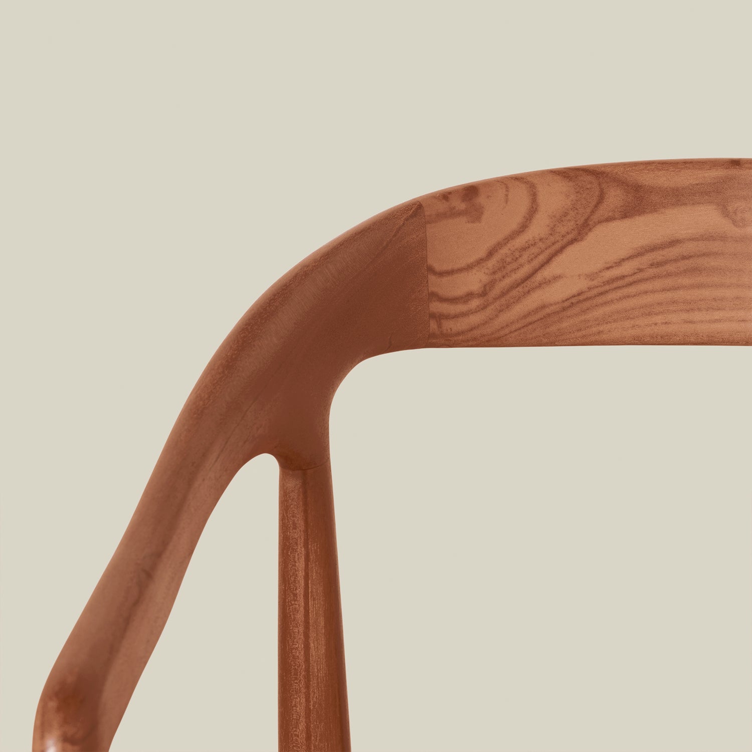 Close-up of a wooden chair arm on a beige background- Number 5