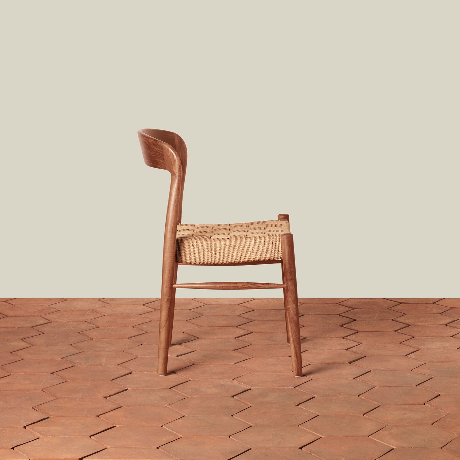 Wooden chair with woven seat on a wooden floor- Number 4