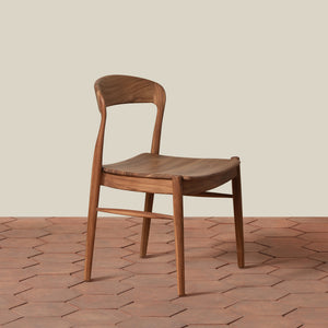 Wooden chair on a wooden floor with a neutral background - Number 1