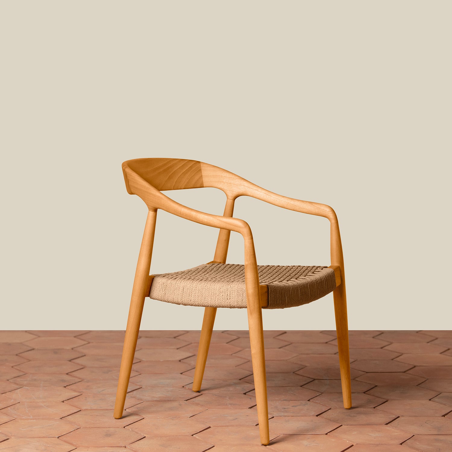 Wooden chair with woven seat on a wooden floor and beige wall background- Number 16