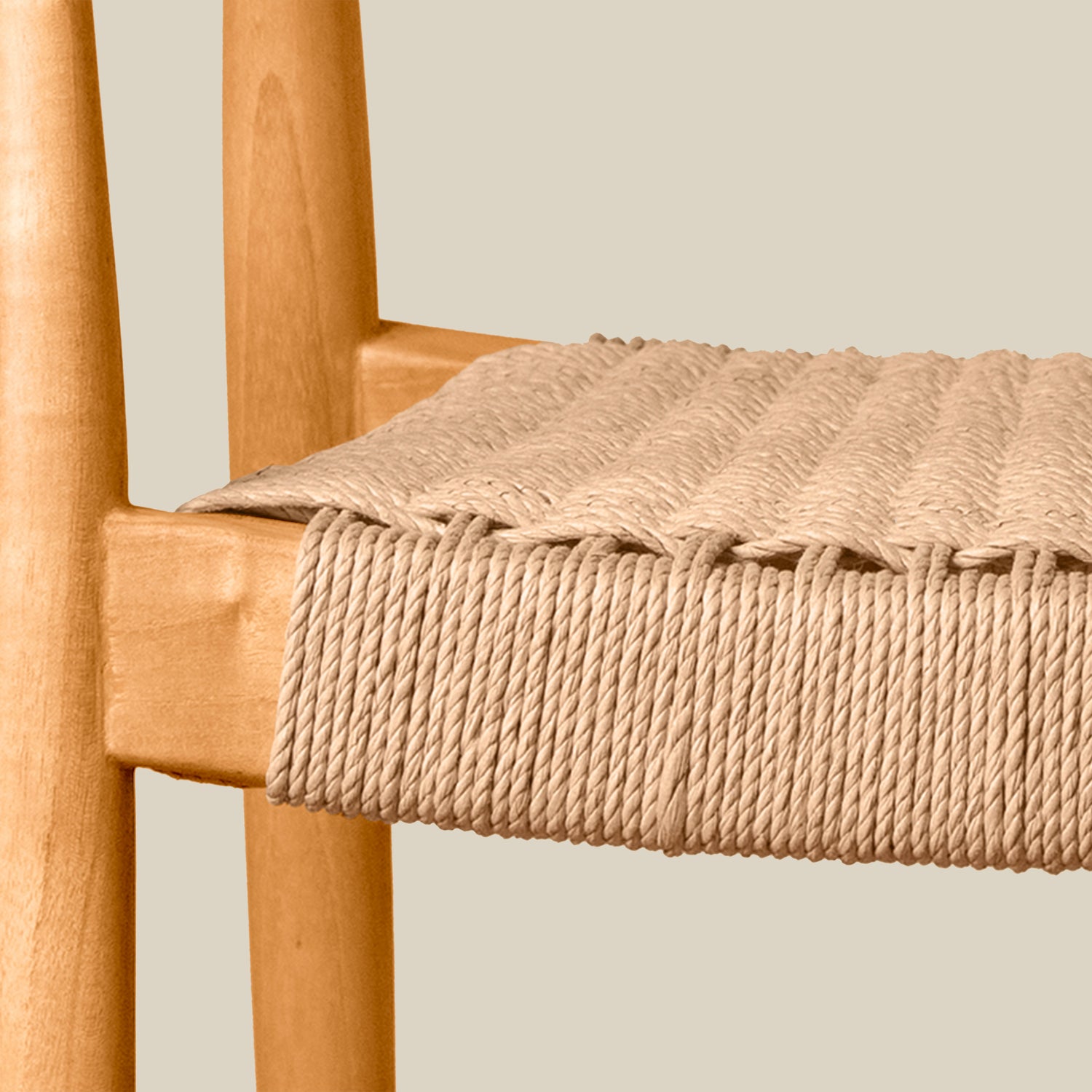 Wooden chair with a woven beige rope seat on a plain background- Number 21