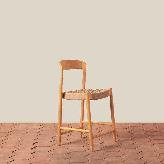 oak counter stool on tiled floor