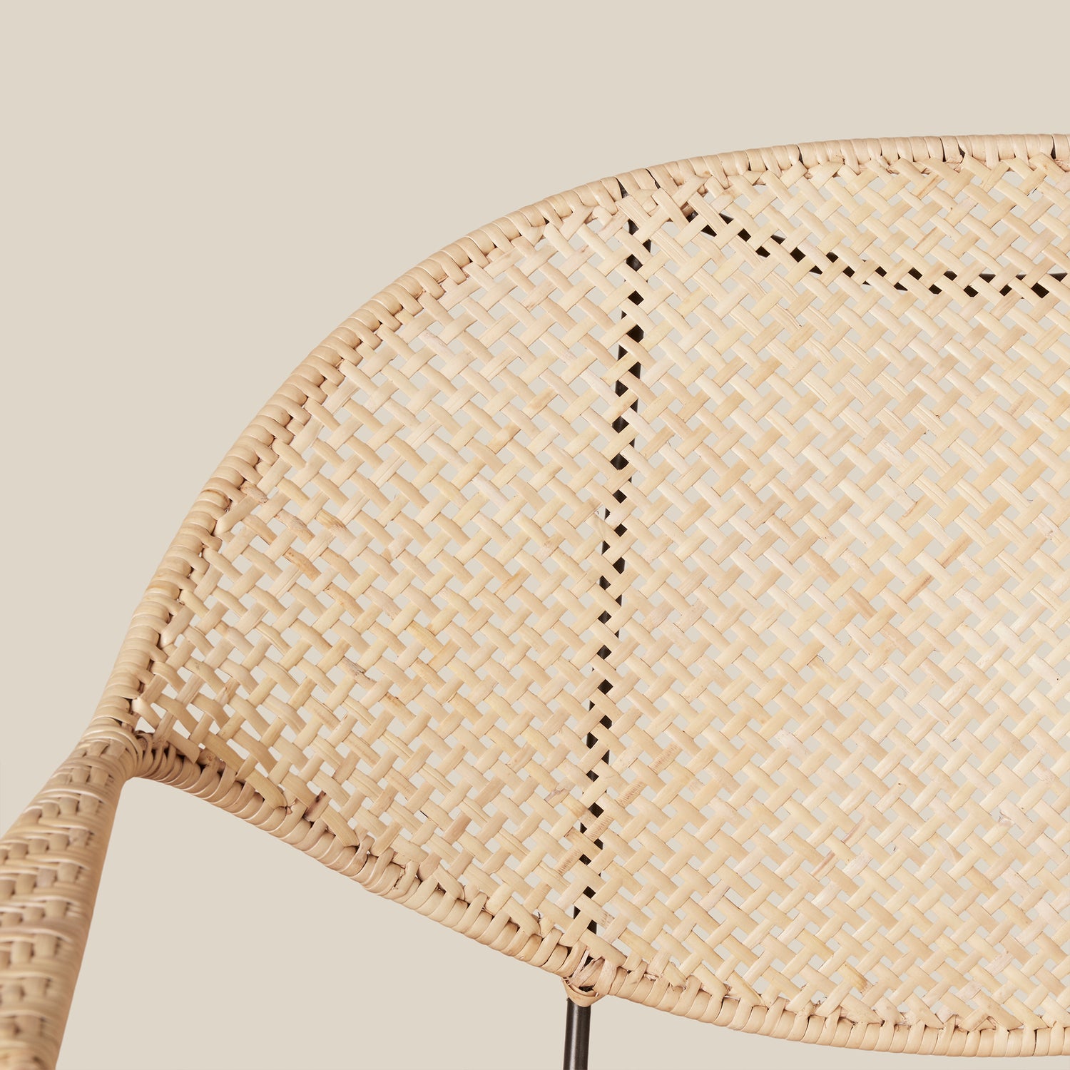 close up of white rattan woven chair back against neutral background- Number 11
