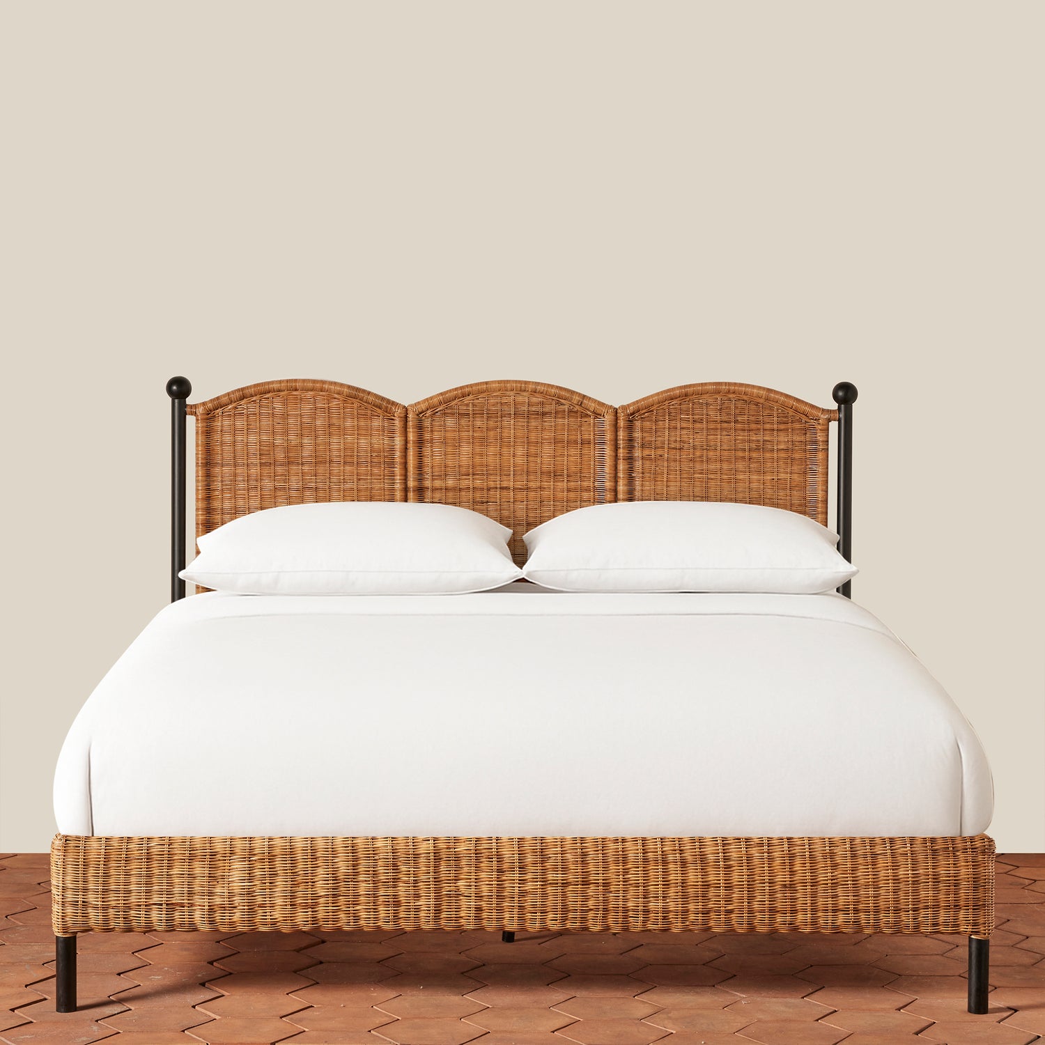 Bed with wicker headboard and footboard on a wooden floor with beige wall background- Number 5