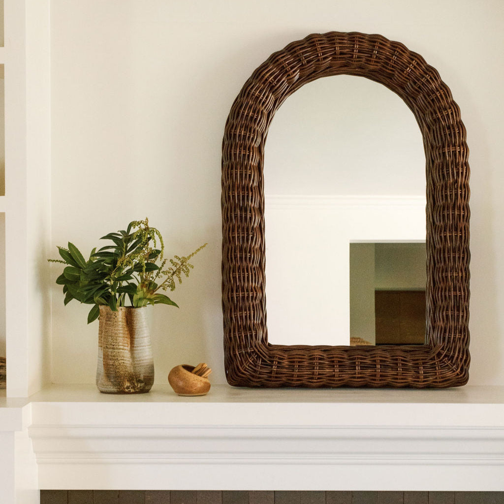 mirror next to small plant