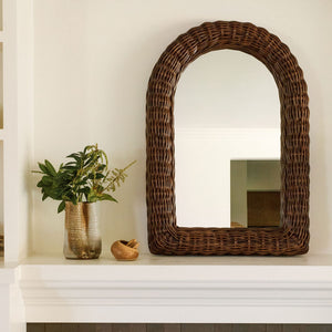 mirror next to small plant