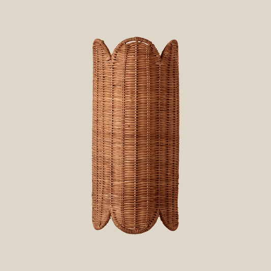 Wicker wall sconce on a beige background