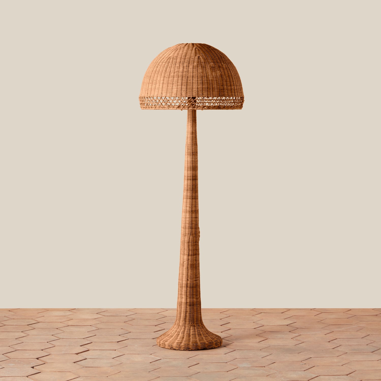 Woven floor lamp on a wooden floor with a neutral background- Number 1
