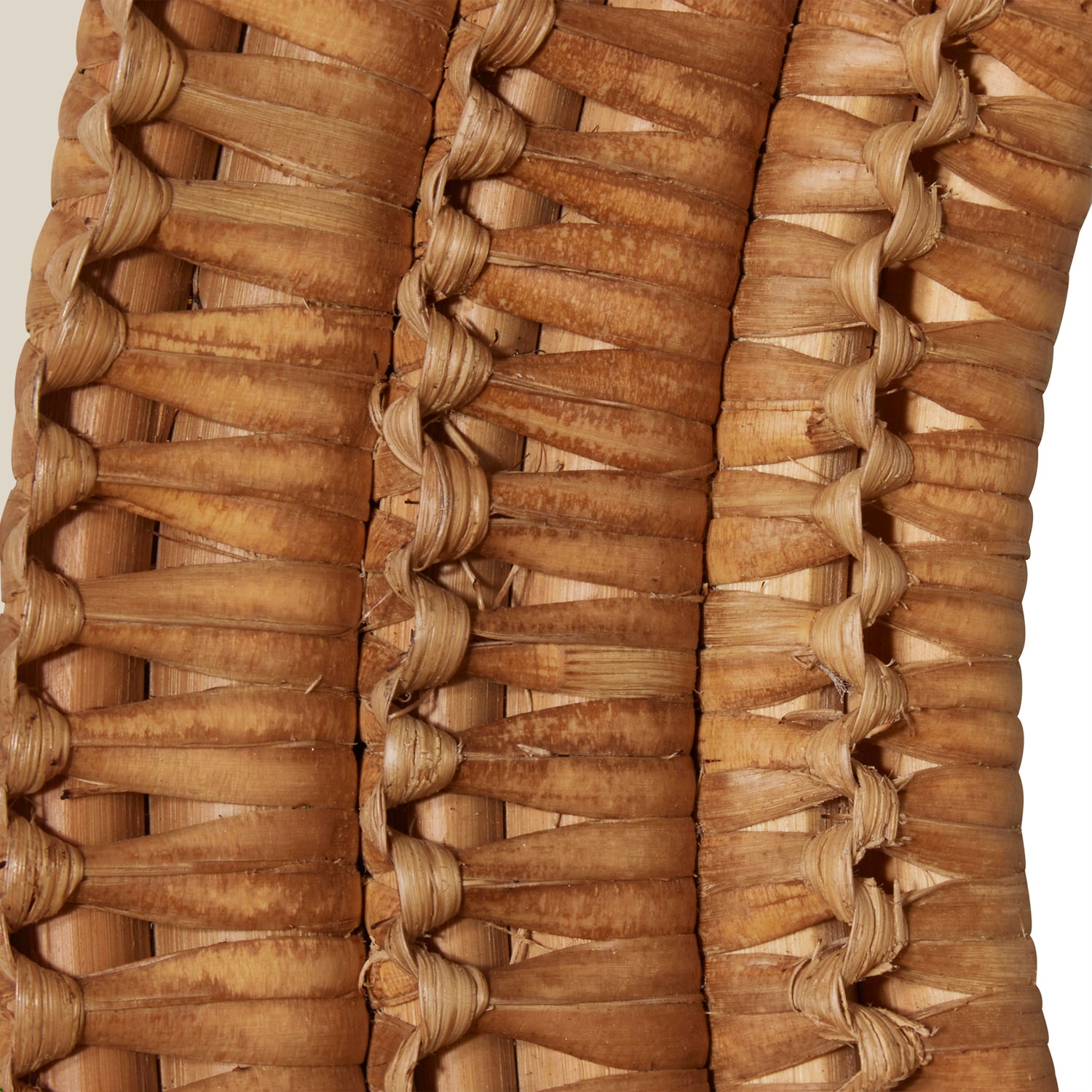 Close up of a round mirror with a woven wicker brown frame- Number 6