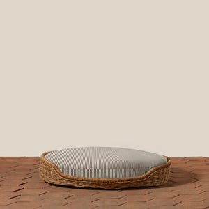 black and white striped dog bed with woven exterior on tile floor - Number 18