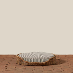 Wicker pet bed with striped cushion on a wooden floor - Number 14