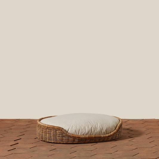 medium sized dog bed with stripes on tiled floor 