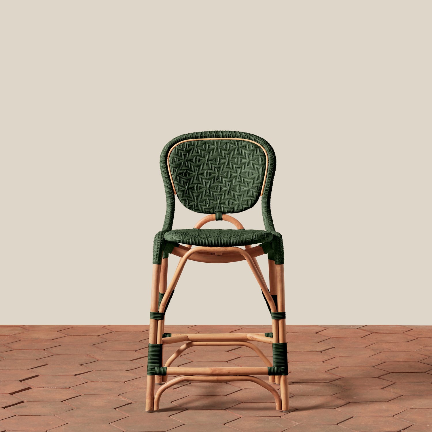 Green woven chair with wooden frame on a beige background- Number 17