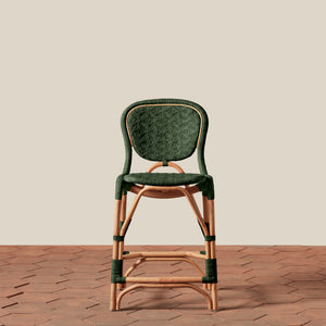 Green woven chair with wooden frame on a beige background - Number 17