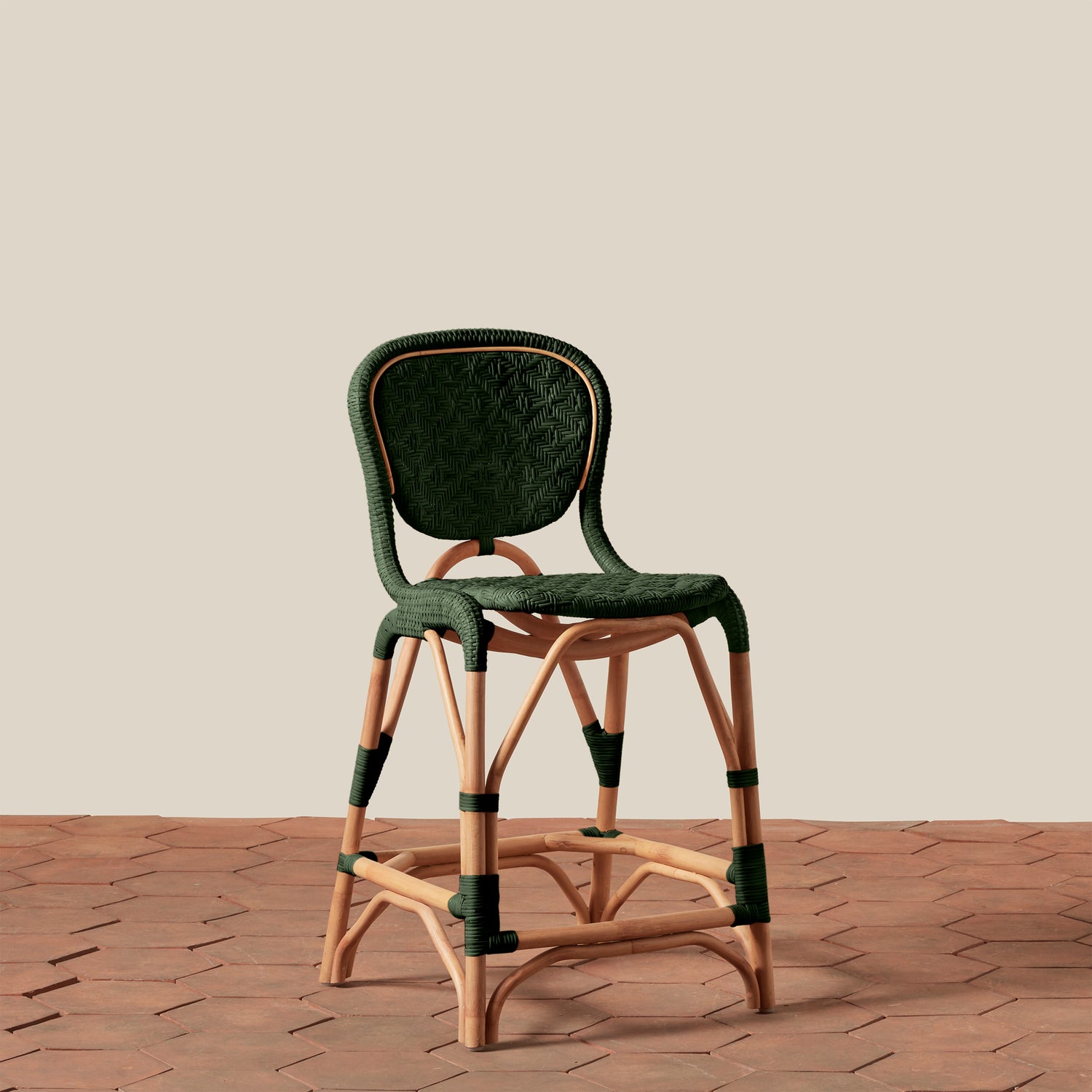 Green bar stool with wooden legs on a beige background- Number 13