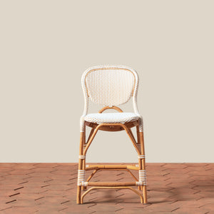Wicker chair with a white cushion on a wooden floor and beige wall background - Number 5