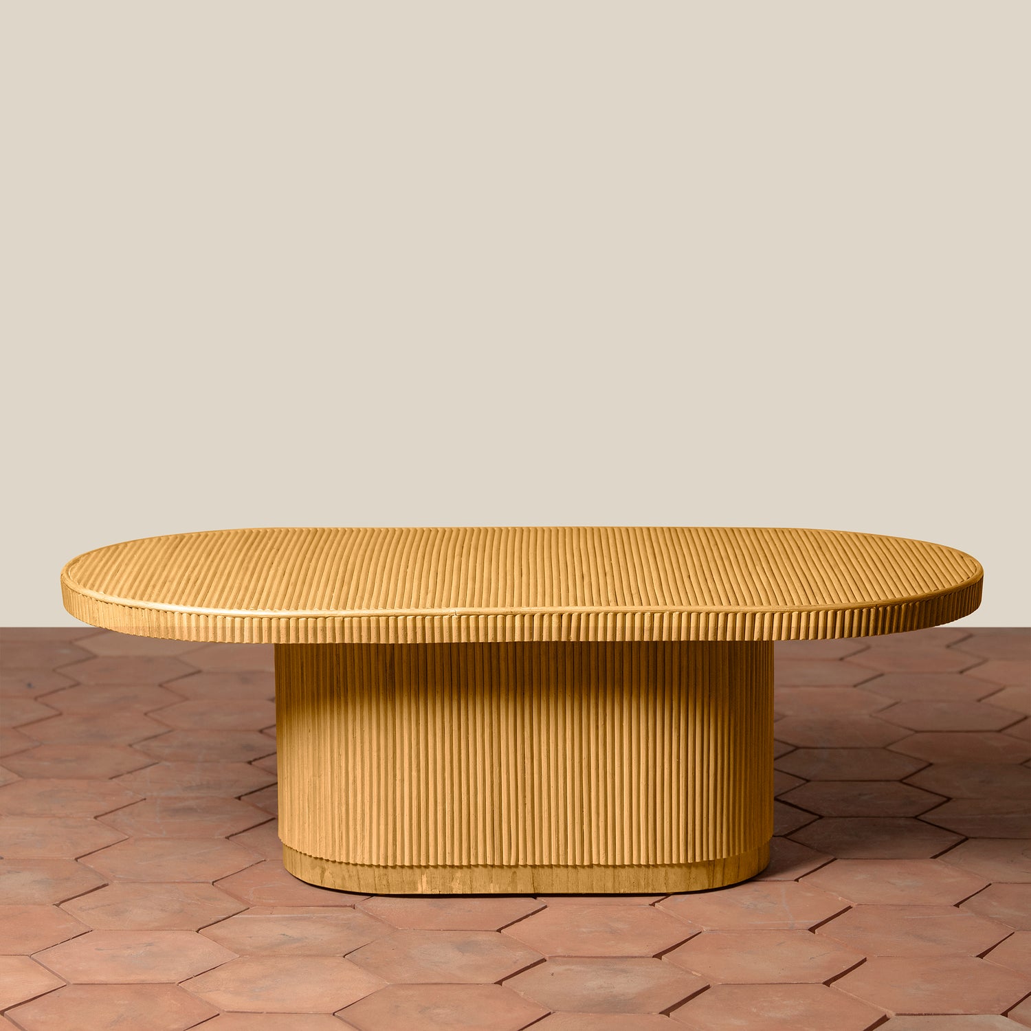 Wooden coffee table with a textured surface on a patterned floor.- Number 4