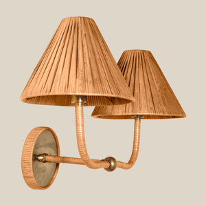 A two-light wall sconce with pleated beige shades, flexible rope-wrapped arms, and a round textured backplate on a solid light beige background. - Number 3
