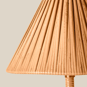 Close-up of a pleated natural rattan lampshade on a light beige background. - Number 5