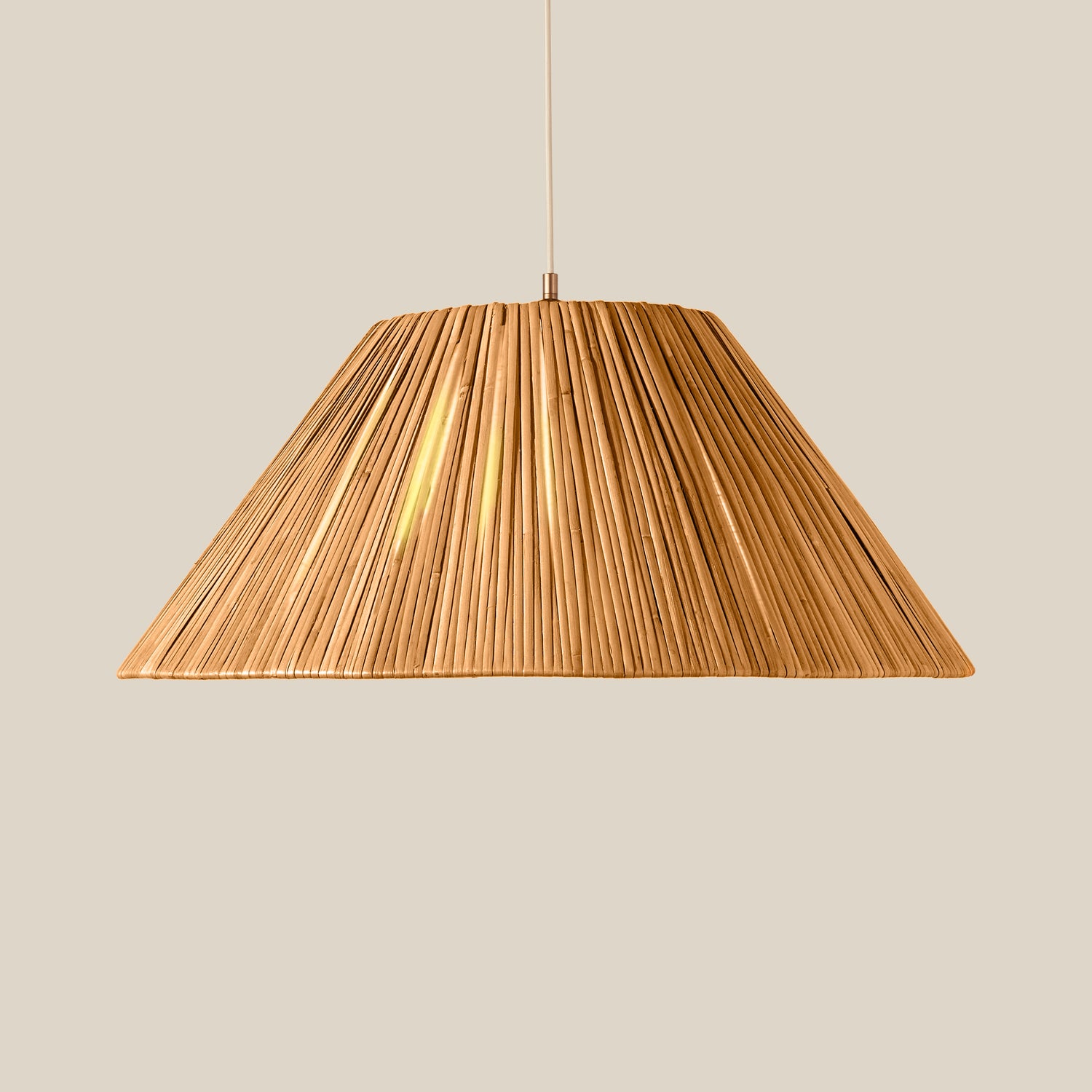 A modern pendant light with a wide, conical shade made of tightly packed, vertically oriented rattan suspended by a thin cord against a solid, warm beige background.- Number 3