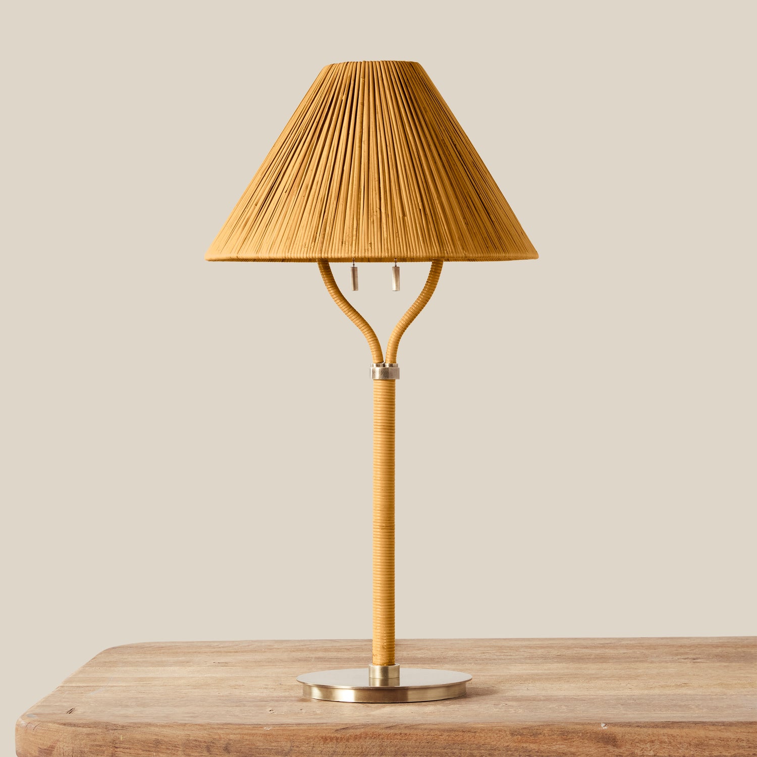 Table lamp with pleated brown shade on a wooden surface- Number 1