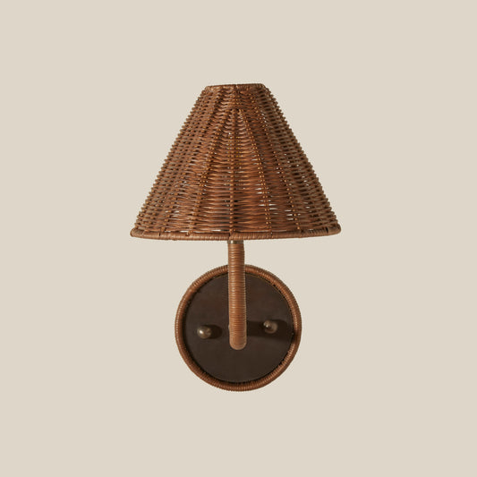 Wicker wall sconce with a brown shade on a beige background