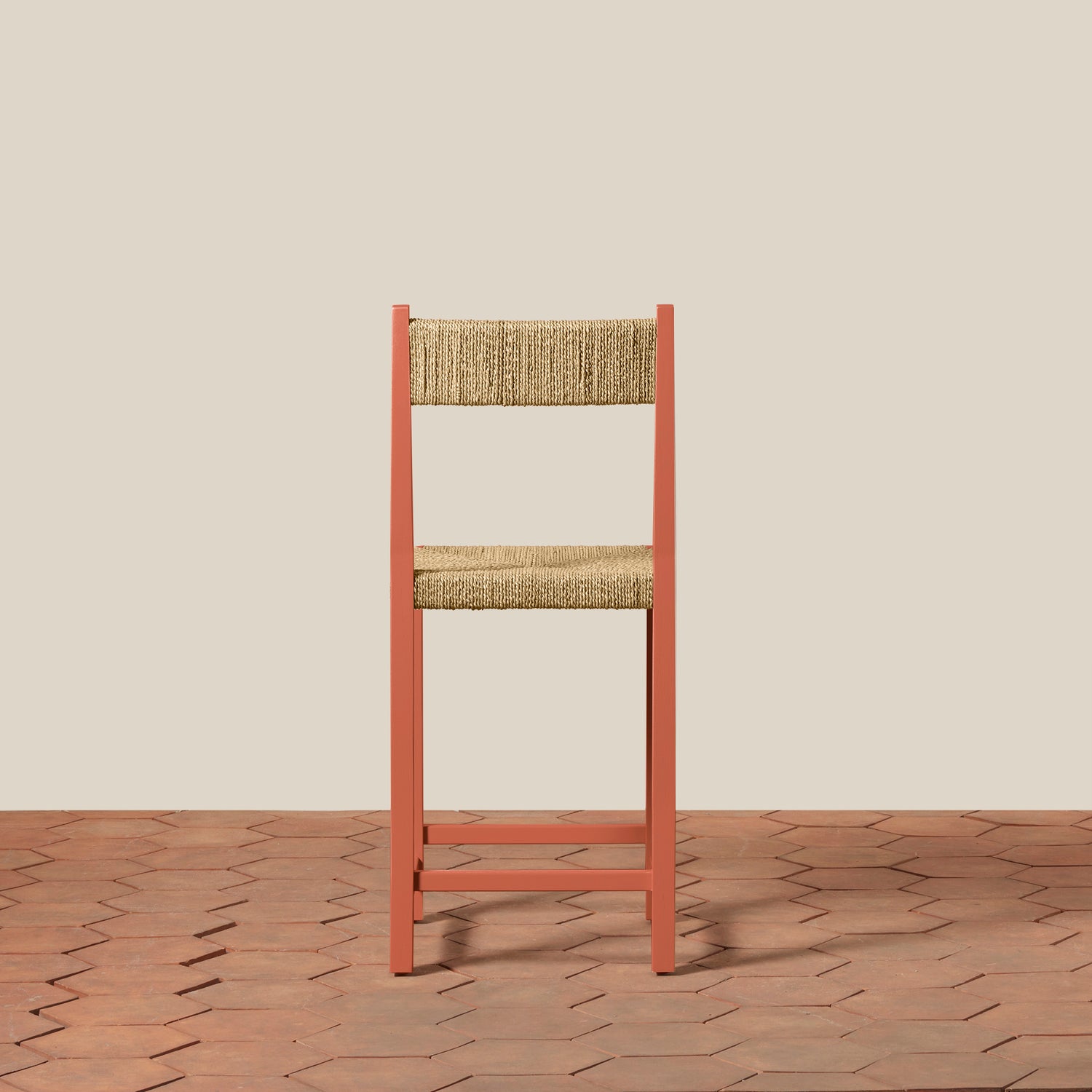 Wooden chair with woven seat and backrest on a wooden floor and beige wall background- Number 4