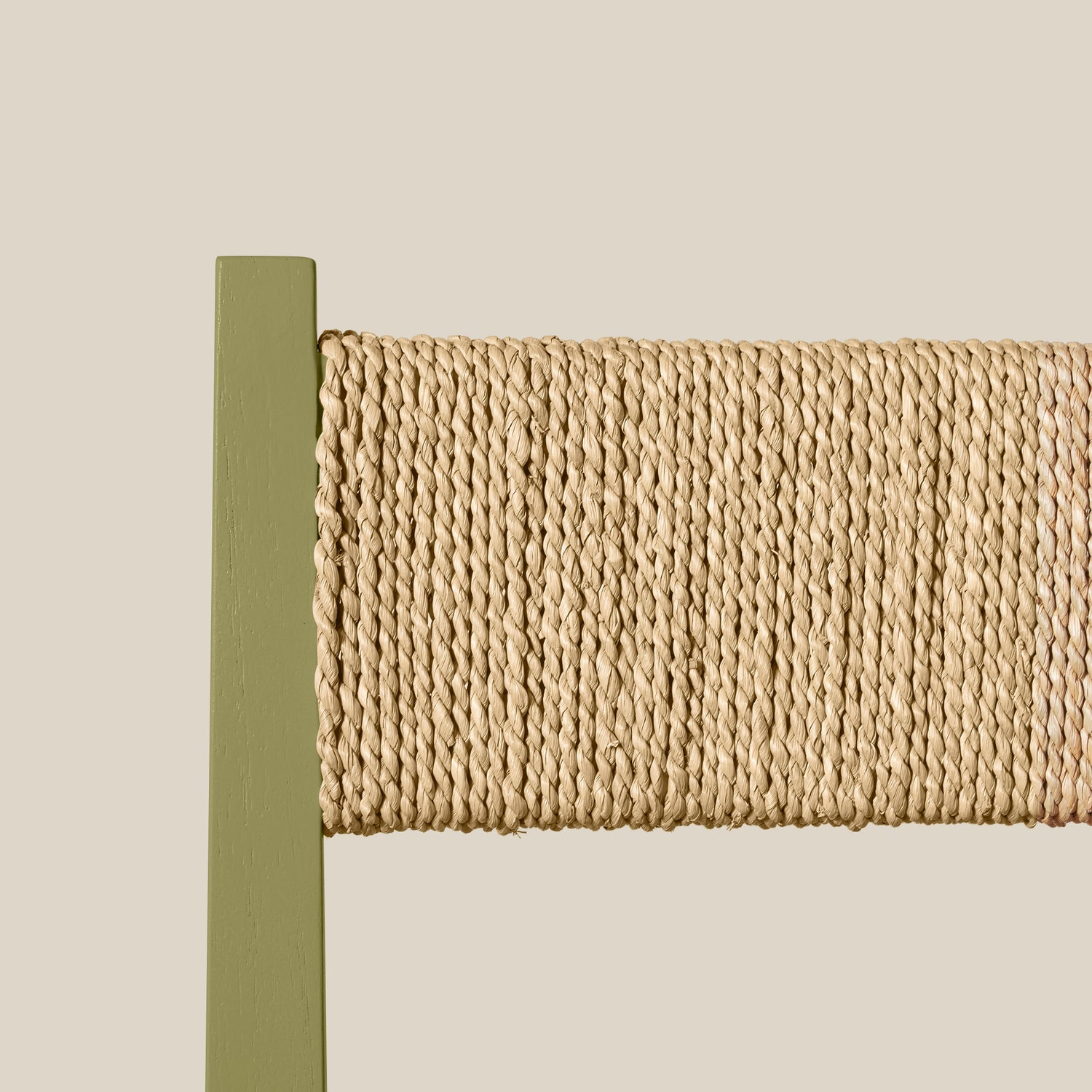 Woven back rest with a green border on a beige background- Number 23