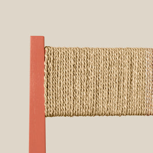 Close-up of a woven counter stool corner with a wooden border on a beige background - Number 5