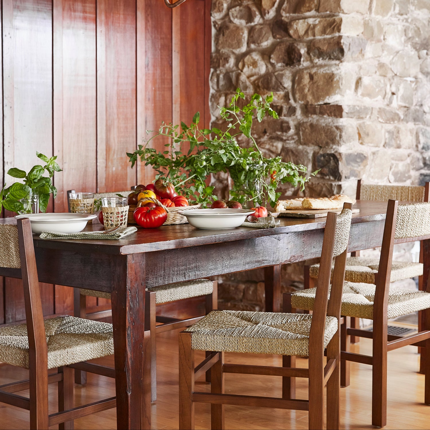wood chairs next to table with greens and tomatoes on top- Number 2