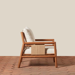 Wooden armchair with a woven side on a wooden floor and beige wall background - Number 2
