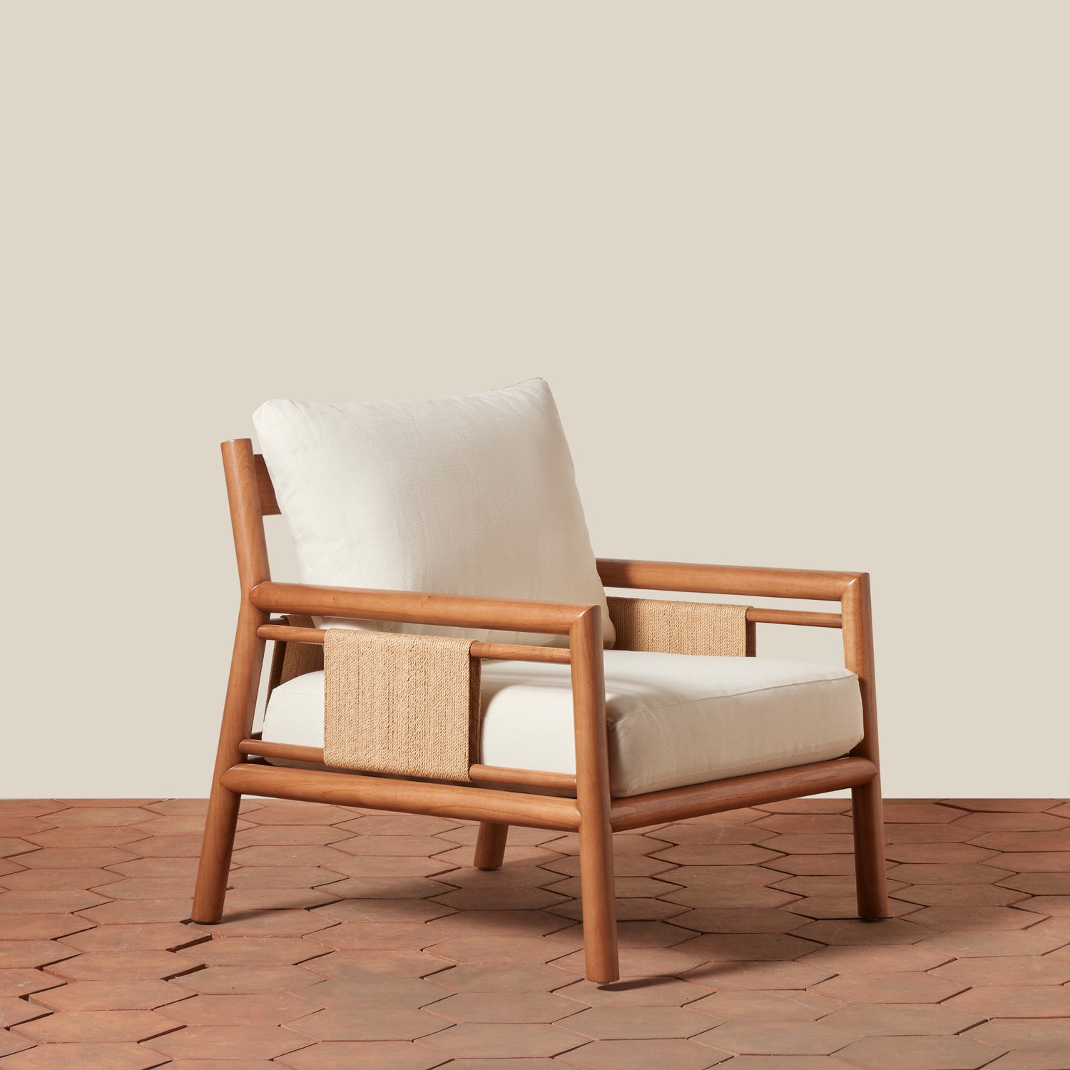 Wooden armchair with white cushion on a wooden floor and beige wall background- Number 1