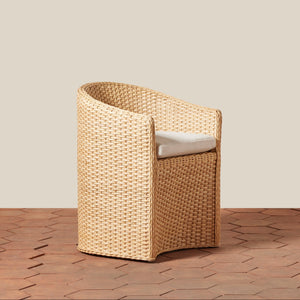 Woven chair with a cushion on a wooden floor and beige wall background - Number 1