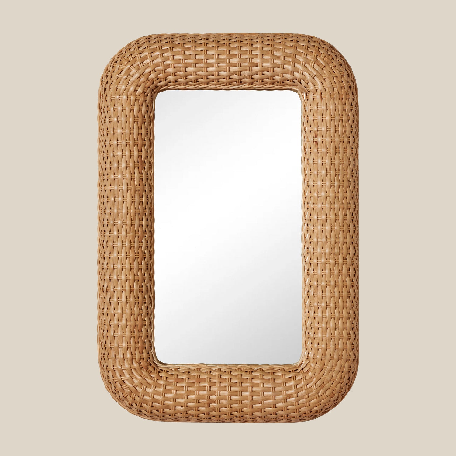 Rectangular mirror with a woven rattan frame on a beige background- Number 1